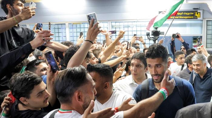 ‘Iran, Iran!’ Iranian World Cup squad serenaded on return home